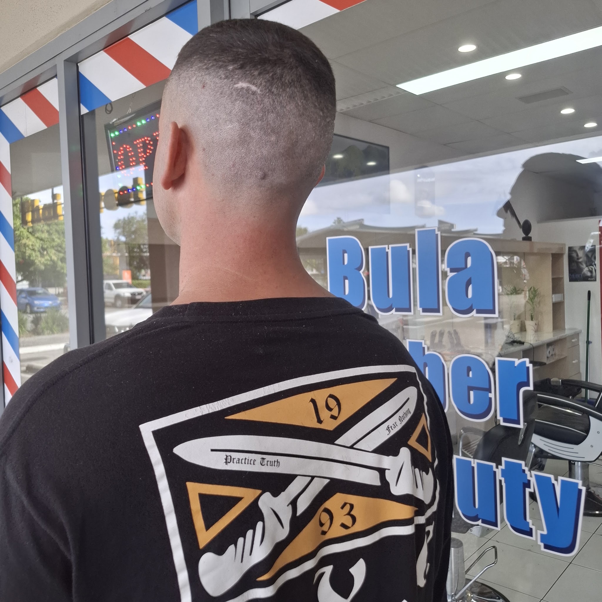 A freshly cut short fade, photographed outside the shop window